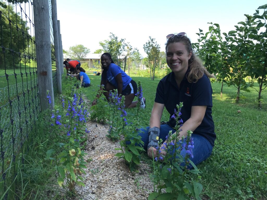 Students planting in Pete's Giving Garden